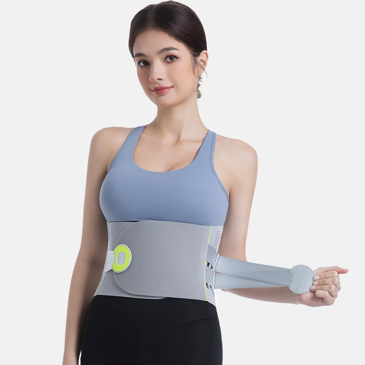 Woman demonstrating a back support with compression straps, offering targeted support and comfort