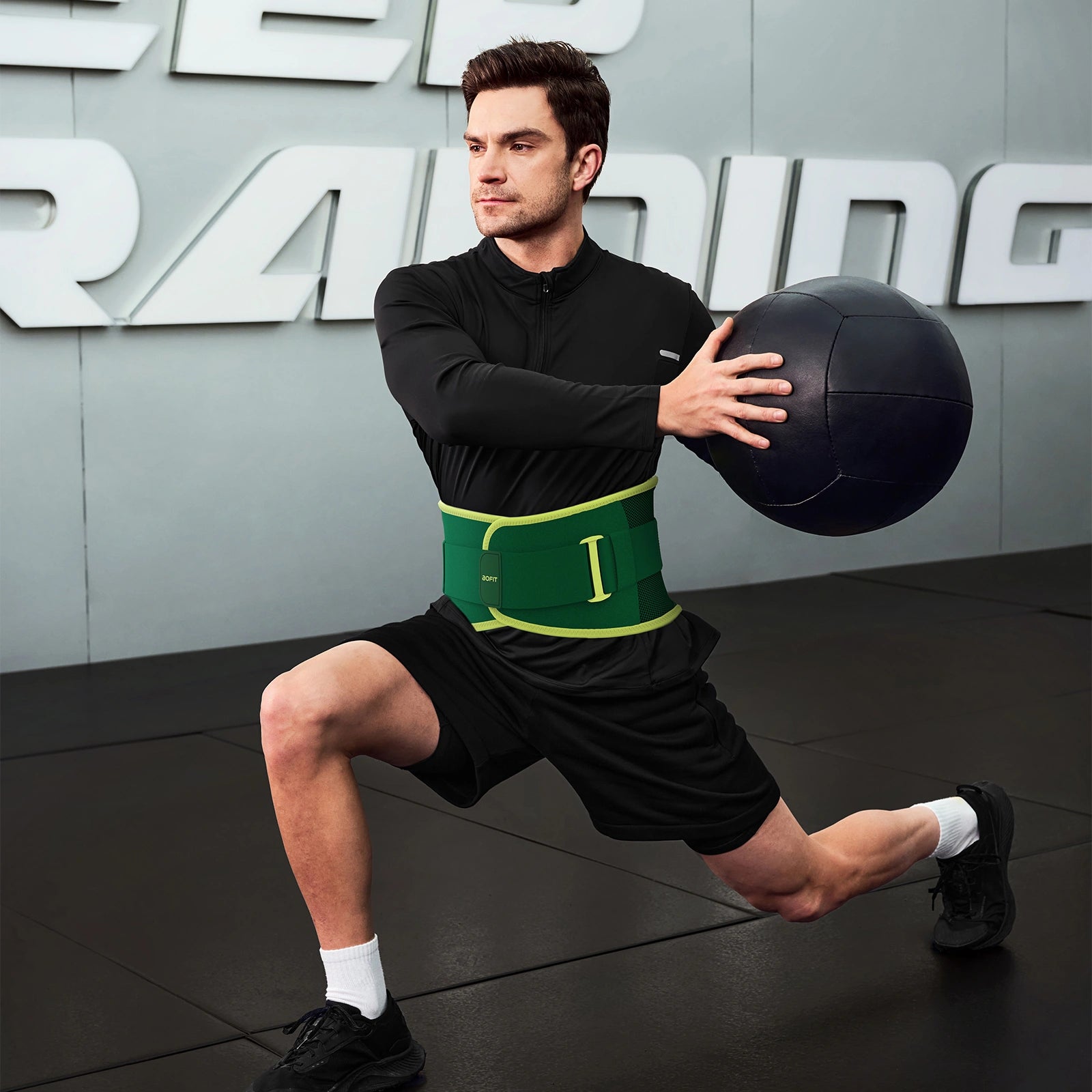 Man exercising with a medicine ball in a gym setting